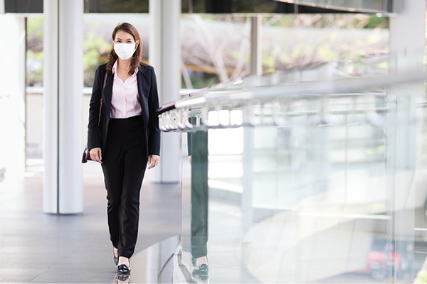Woman walking with mask